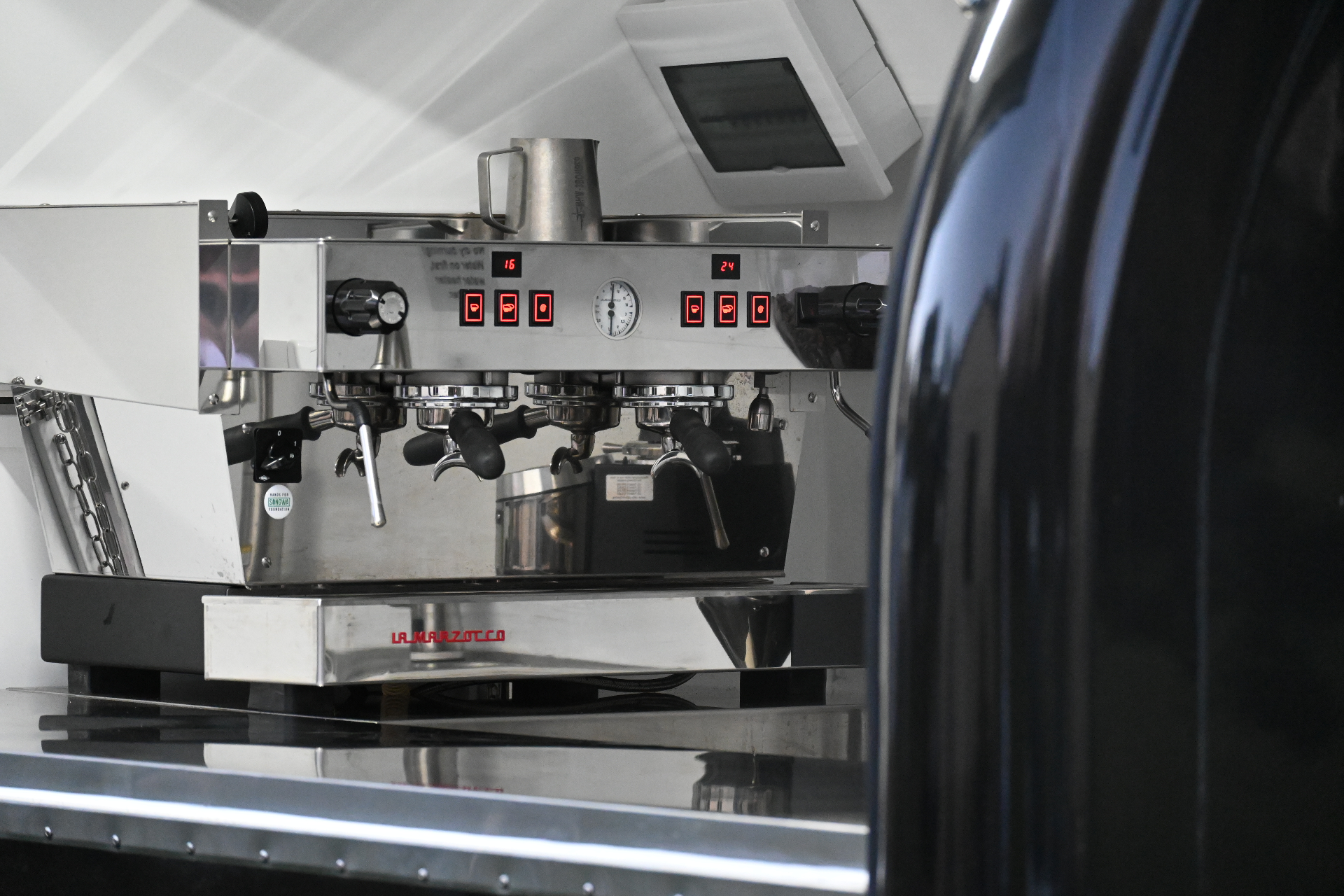 La Marzocco espresso machine inside the cart